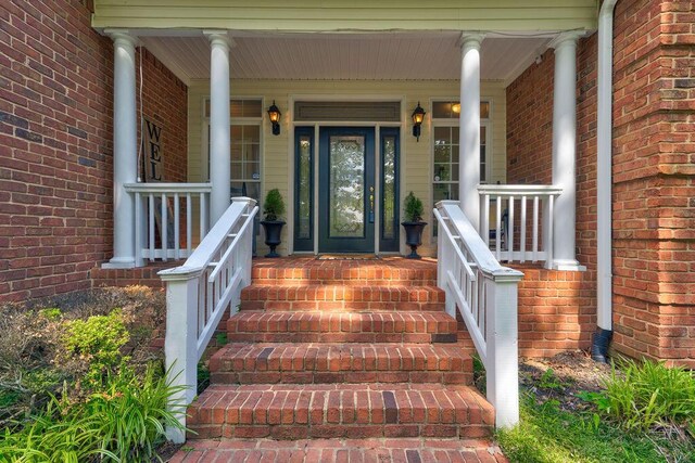 81 Arnold Rd, Rock Spring, GA 30739 - view of exterior entry with covered porch and brick siding