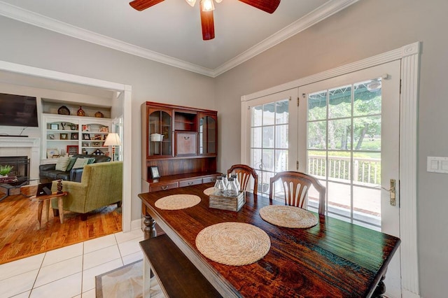 81 Arnold Rd, Rock Spring, GA 30739 - dining room with crown molding, a ceiling fan, light tile patterned floors, and a fireplace