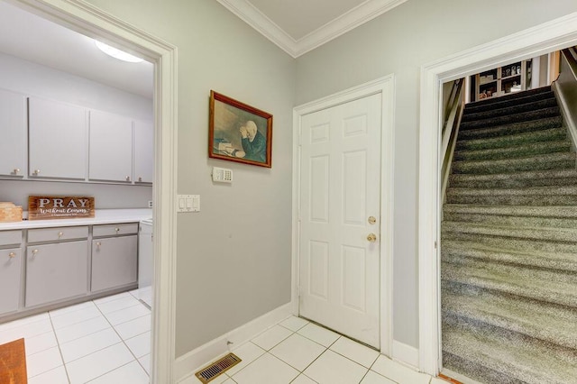 81 Arnold Rd, Rock Spring, GA 30739 - entrance foyer with light tile patterned floors, baseboards, ornamental molding, and stairway