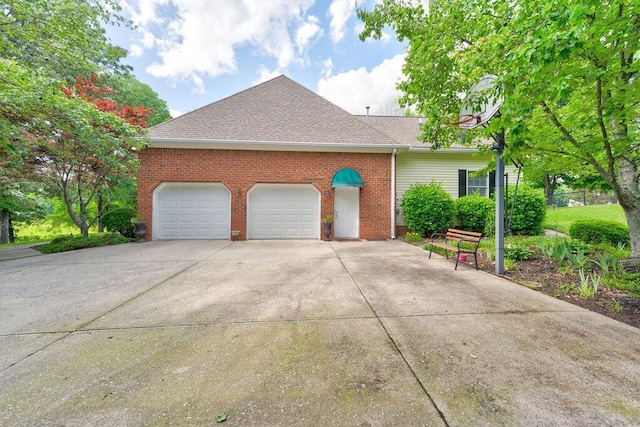 81 Arnold Rd, Rock Spring, GA 30739 - view of side of home featuring brick siding, a garage, driveway, and a shingled roof