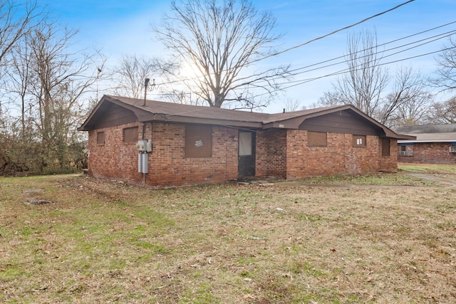 1638 E 17th St, Chattanooga, TN 37404 - view of front facade with brick siding and a front lawn