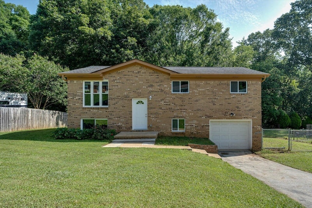 1373 Meadowood Dr, Hixson, TN 37343 - view of front of property with a garage, concrete driveway, and brick siding