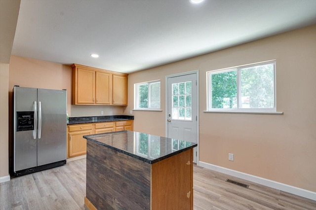 1373 Meadowood Dr, Hixson, TN 37343 - kitchen with stainless steel refrigerator with ice dispenser, light wood-type flooring, light brown cabinetry, baseboards, and recessed lighting