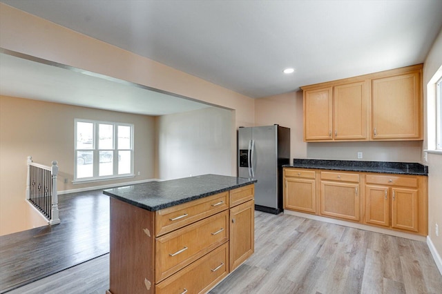 1373 Meadowood Dr, Hixson, TN 37343 - kitchen featuring stainless steel refrigerator with ice dispenser, light wood-style flooring, recessed lighting, a center island, and baseboards
