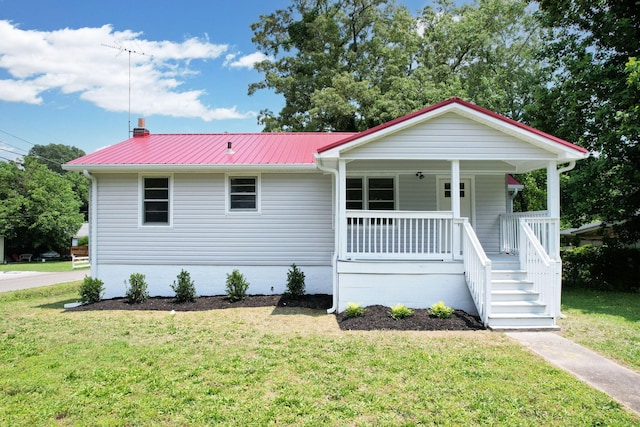 1204 Greenwood Rd, Chattanooga, TN 37411 - view of front facade with a porch, a front lawn, and metal roof