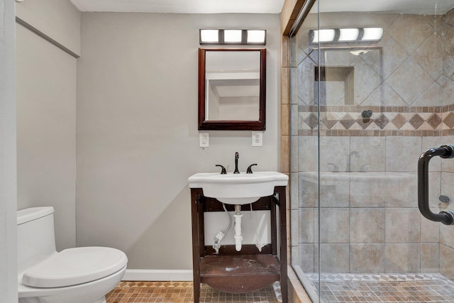 1204 Greenwood Rd, Chattanooga, TN 37411 - full bathroom featuring toilet, a shower stall, baseboards, and tile patterned flooring