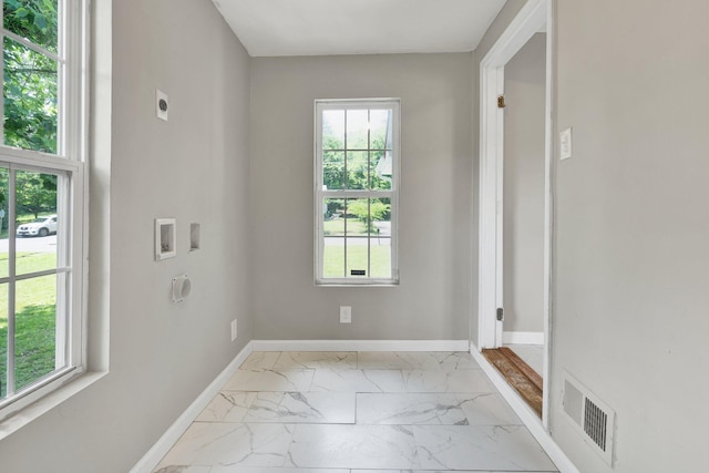 1204 Greenwood Rd, Chattanooga, TN 37411 - unfurnished room featuring light marble finish flooring, healthy amount of natural light, and baseboards