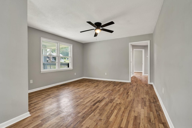 1204 Greenwood Rd, Chattanooga, TN 37411 - empty room featuring wood finished floors, ceiling fan, and baseboards