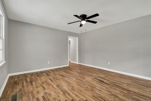 1204 Greenwood Rd, Chattanooga, TN 37411 - empty room with wood finished floors, baseboards, and ceiling fan