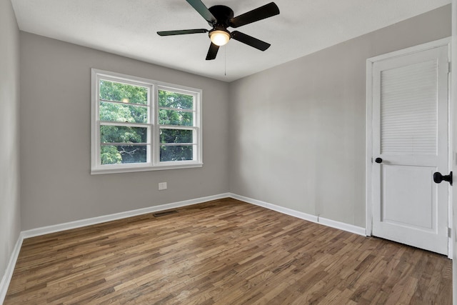1204 Greenwood Rd, Chattanooga, TN 37411 - spare room featuring wood finished floors, baseboards, and a ceiling fan