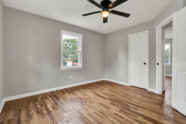 1204 Greenwood Rd, Chattanooga, TN 37411 - spare room featuring wood finished floors, ceiling fan, and baseboards
