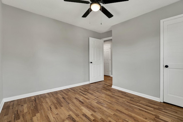 1204 Greenwood Rd, Chattanooga, TN 37411 - unfurnished bedroom featuring baseboards, wood finished floors, and a ceiling fan