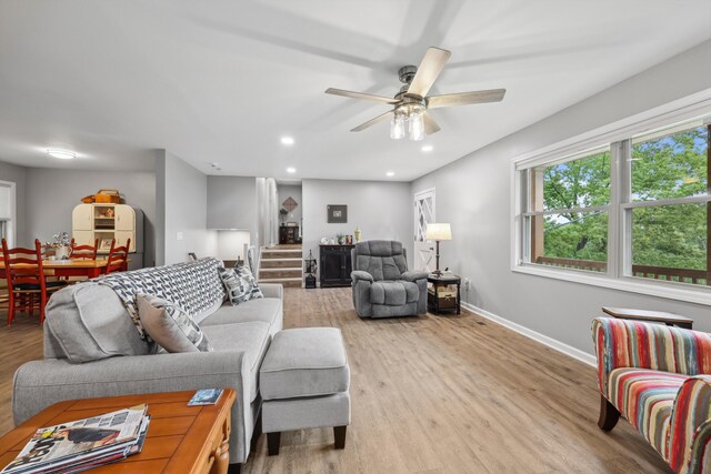 787 Flinn Dr, Chattanooga, TN 37412 - living area featuring light wood finished floors, baseboards, a ceiling fan, recessed lighting, and stairway