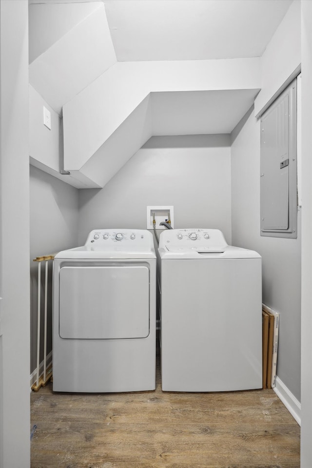 787 Flinn Dr, Chattanooga, TN 37412 - washroom featuring washing machine and dryer, electric panel, and wood finished floors