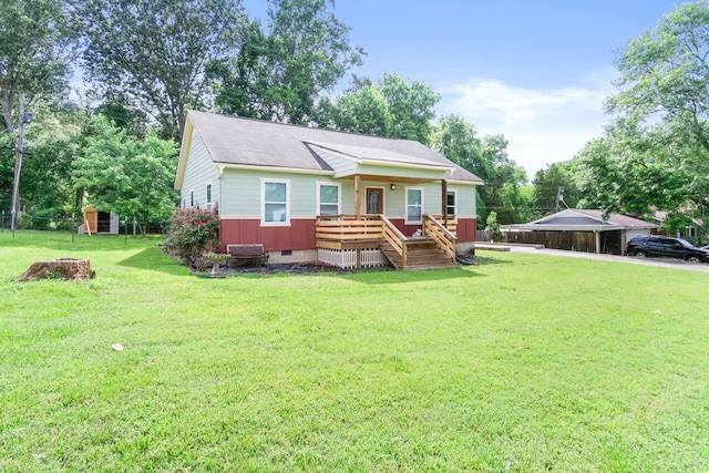 7815 Parkshore Cir, Hixson, TN 37343 - view of front of property with crawl space, a front yard, a deck, a storage unit, and a shingled roof