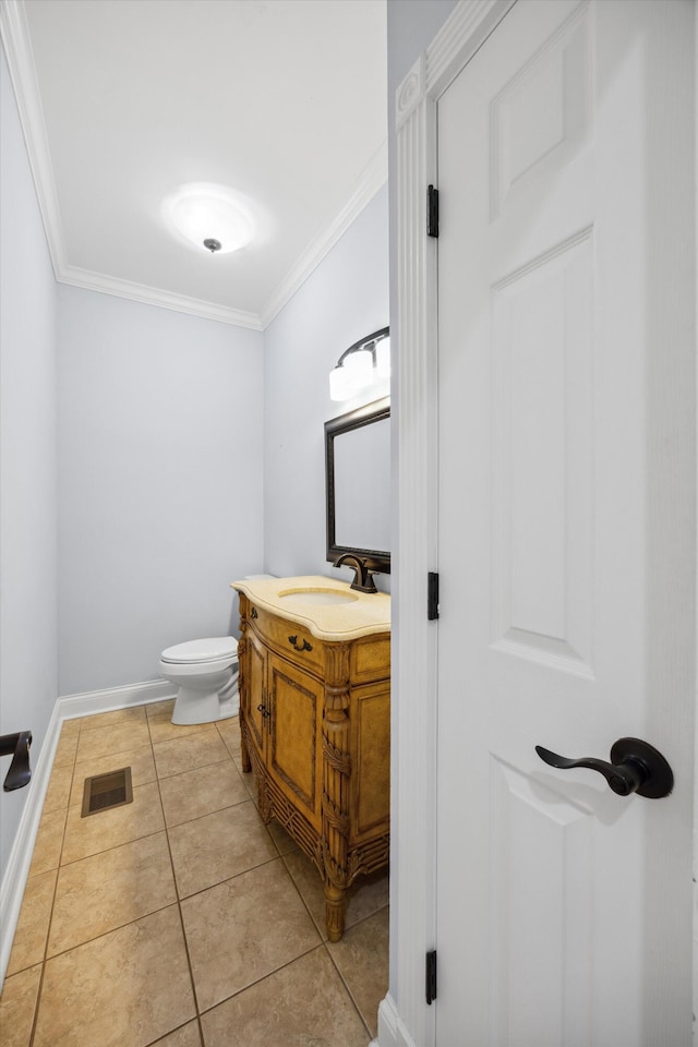 310 Bluffs Rd N, South Pittsburg, TN 37380 - bathroom with vanity, toilet, ornamental molding, tile patterned flooring, and baseboards