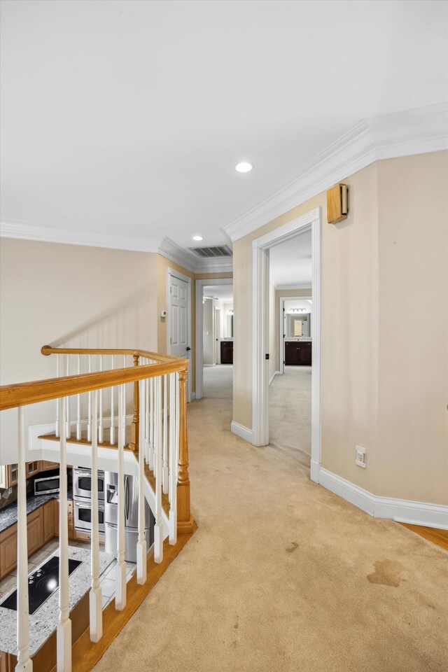 310 Bluffs Rd N, South Pittsburg, TN 37380 - hall featuring crown molding, light carpet, recessed lighting, baseboards, and an upstairs landing