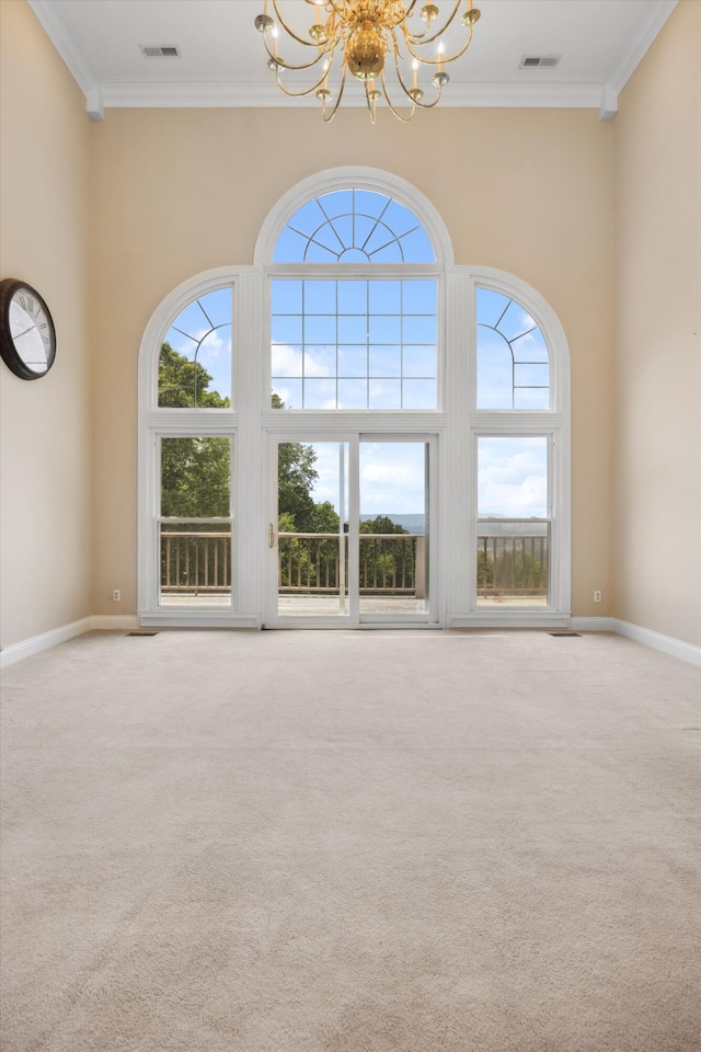 310 Bluffs Rd N, South Pittsburg, TN 37380 - carpeted spare room with a chandelier, plenty of natural light, crown molding, a high ceiling, and baseboards