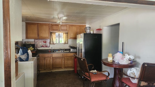 1900 Garfield St, Chattanooga, TN 37404 - kitchen with freestanding refrigerator, brown cabinets, and ornamental molding
