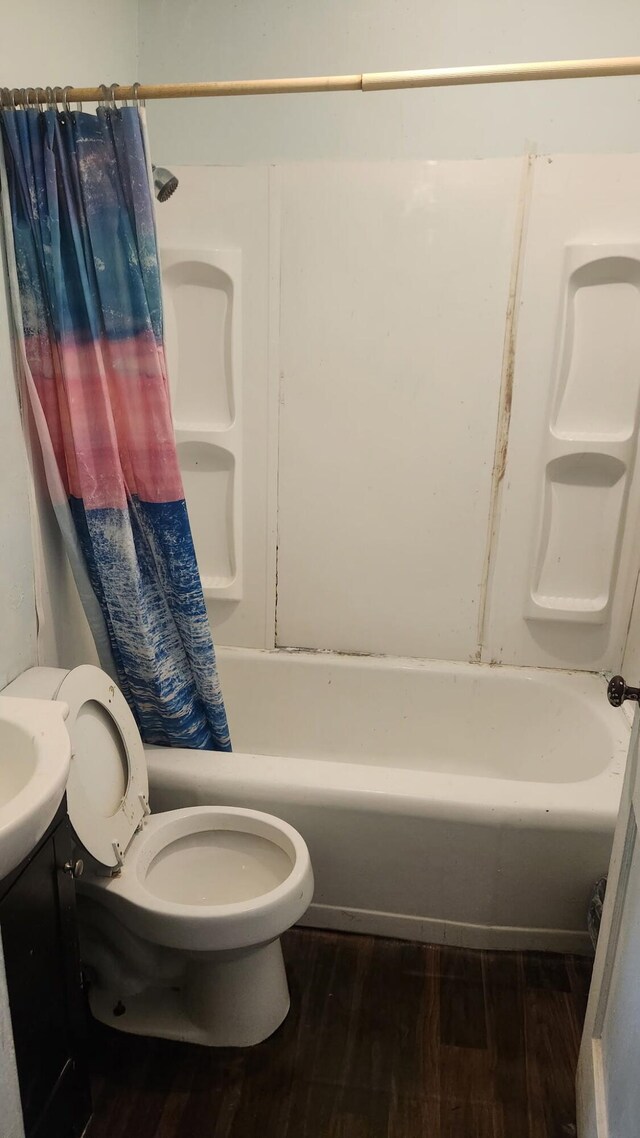 1900 Garfield St, Chattanooga, TN 37404 - full bathroom featuring wood finished floors, shower / bathtub combination with curtain, and vanity