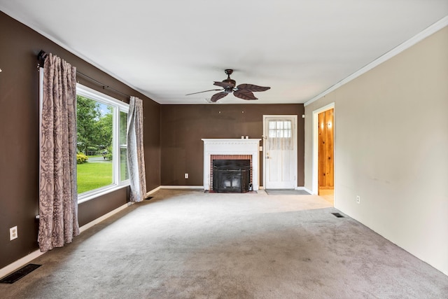 2524 Spring Place Rd SE, Cleveland, TN 37323 - unfurnished living room with ceiling fan, carpet, a brick fireplace, crown molding, and baseboards