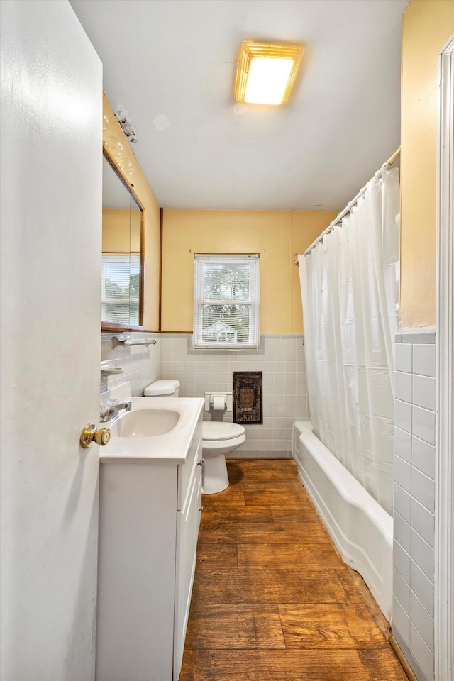2524 Spring Place Rd SE, Cleveland, TN 37323 - bathroom featuring tile walls, vanity, toilet, wood finished floors, and shower / tub combo