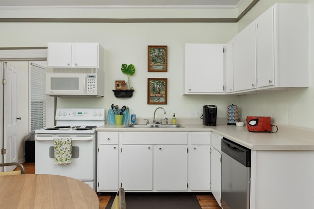 602 Oliver St, Chattanooga, TN 37405 - kitchen featuring white appliances, white cabinets, light countertops, and dark wood-style floors