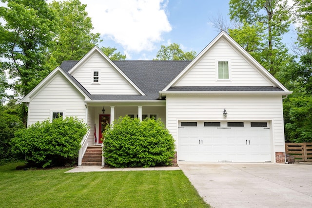 2024 Oak St, Signal Mountain, TN 37377 - view of front of home featuring concrete driveway, covered porch, a shingled roof, and an attached garage