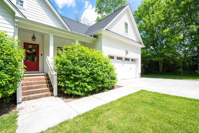 2024 Oak St, Signal Mountain, TN 37377 - view of front of house featuring concrete driveway, a garage, roof with shingles, a front lawn, and a porch