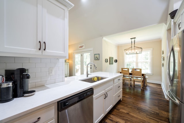 2024 Oak St, Signal Mountain, TN 37377 - kitchen with stainless steel appliances, backsplash, dark wood-style floors, white cabinetry, and light countertops