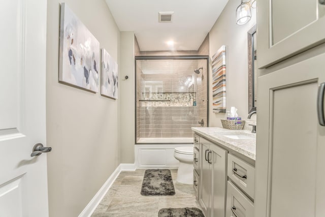 329 Kempton Ln, Dalton, GA 30721 - full bathroom featuring vanity, toilet, enclosed tub / shower combo, and baseboards