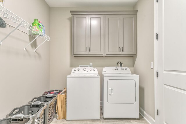 329 Kempton Ln, Dalton, GA 30721 - laundry area with independent washer and dryer, cabinet space, and baseboards