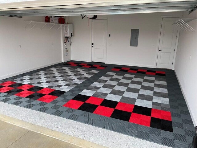 329 Kempton Ln, Dalton, GA 30721 - garage featuring electric panel, baseboards, and water heater