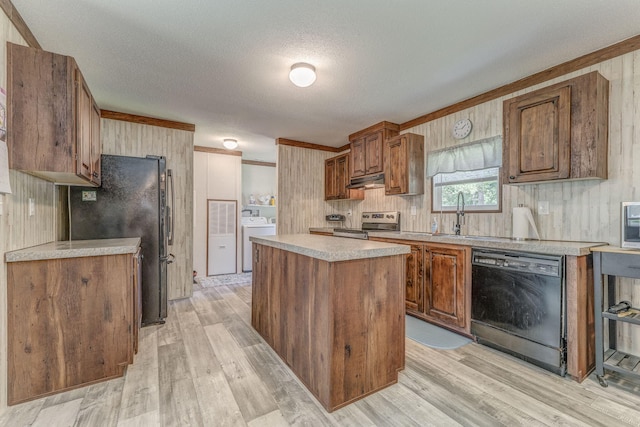 1005 Cohutta Beaverdale Rd, Cohutta, GA 30710 - kitchen with black appliances, light countertops, a kitchen island, under cabinet range hood, and a textured ceiling
