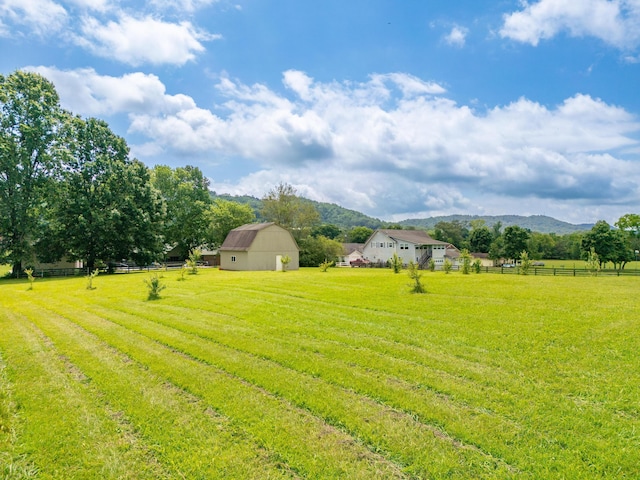 2195 Ooltewah Ringgold Rd, Ooltewah, TN 37363 - view of yard featuring a barn, a rural view, a mountain view, and an outbuilding