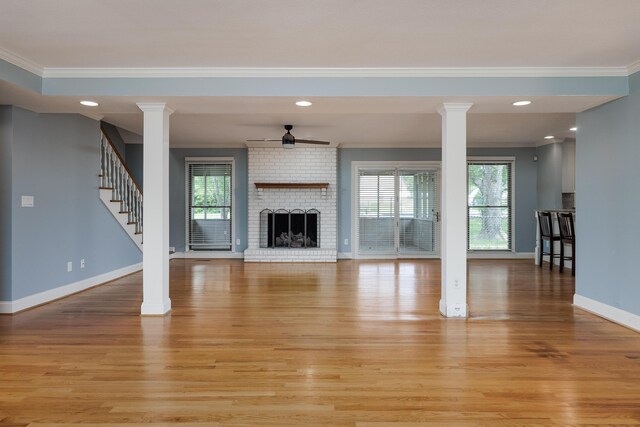 2195 Ooltewah Ringgold Rd, Ooltewah, TN 37363 - unfurnished living room featuring crown molding, ornate columns, a ceiling fan, healthy amount of natural light, and recessed lighting