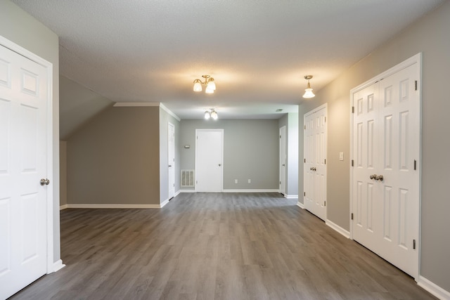 2195 Ooltewah Ringgold Rd, Ooltewah, TN 37363 - additional living space featuring wood finished floors and vaulted ceiling
