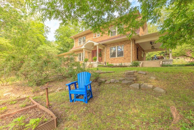 3909 Sunset Ave, Chattanooga, TN 37411 - view of front of property featuring a ceiling fan, a garden, brick siding, and a chimney