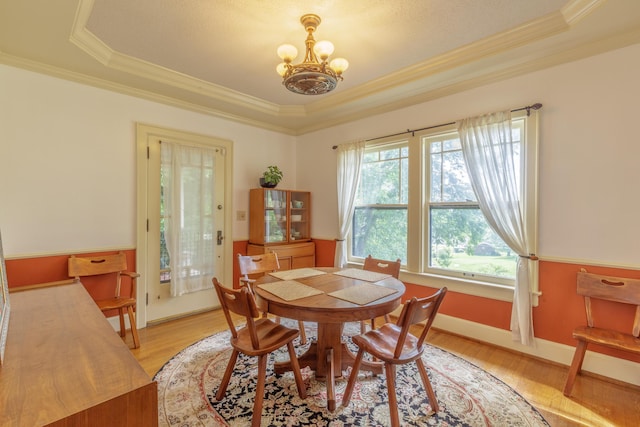 3909 Sunset Ave, Chattanooga, TN 37411 - dining space featuring a chandelier, ornamental molding, a tray ceiling, light wood-type flooring, and baseboards