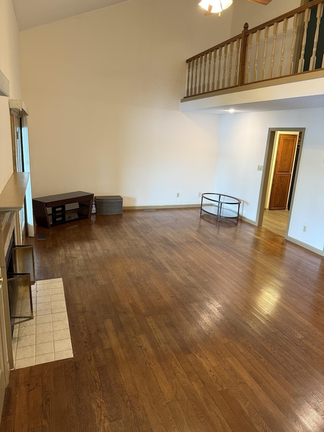11640 Hixson Pike, Soddy Daisy, TN 37379 - unfurnished living room with hardwood / wood-style flooring, ceiling fan, a high ceiling, and baseboards