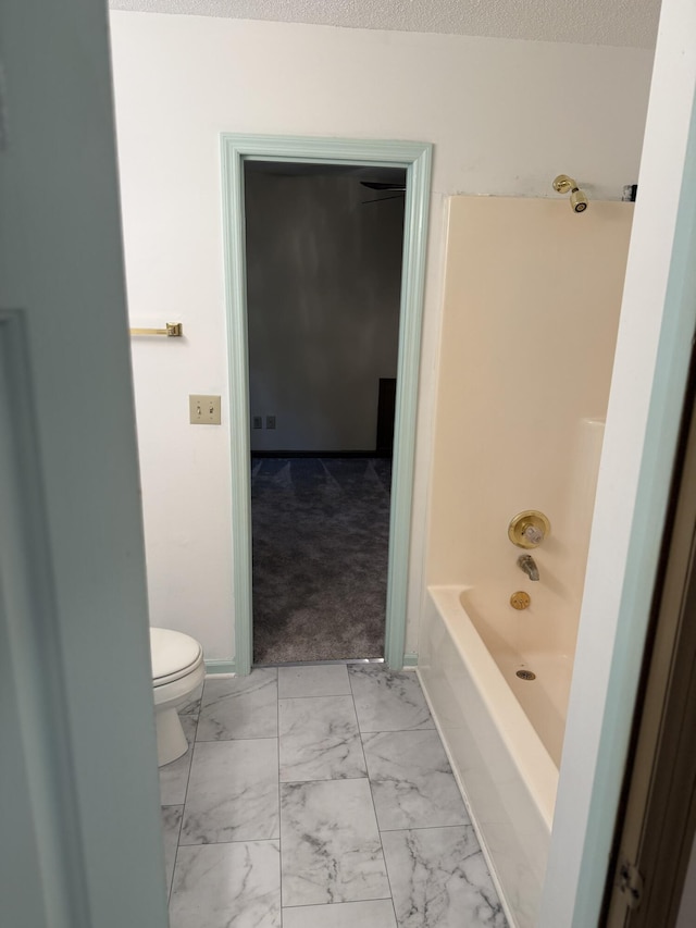 11640 Hixson Pike, Soddy Daisy, TN 37379 - bathroom with toilet, marble look tiles, and shower / bathtub combination