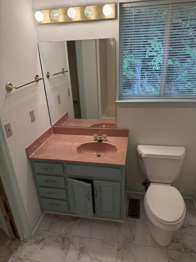 11640 Hixson Pike, Soddy Daisy, TN 37379 - bathroom with marble look tile flooring, vanity, toilet, and baseboards