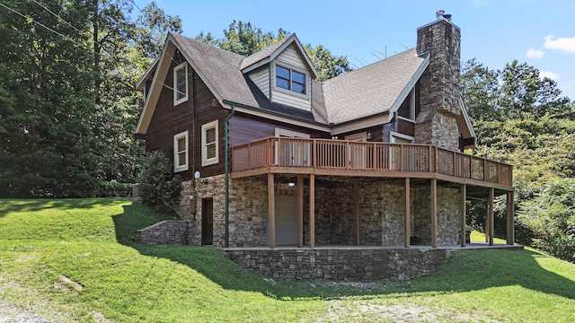 7524 Banther Rd, Harrison, TN 37341 - rear view of house with a deck, stone siding, and a lawn