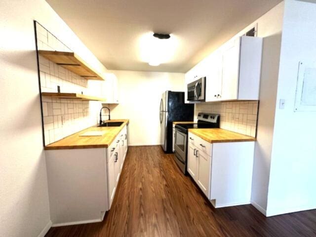 900 Mountain Creek Rd Unit V 478, Chattanooga, TN 37405 - kitchen with butcher block countertops, stainless steel appliances, a sink, backsplash, and dark wood-type flooring