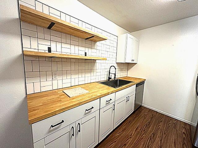 900 Mountain Creek Rd Unit V 478, Chattanooga, TN 37405 - kitchen with open shelves, a sink, butcher block counters, stainless steel dishwasher, and backsplash