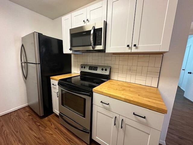 900 Mountain Creek Rd Unit V 478, Chattanooga, TN 37405 - kitchen with appliances with stainless steel finishes, butcher block counters, and dark wood finished floors