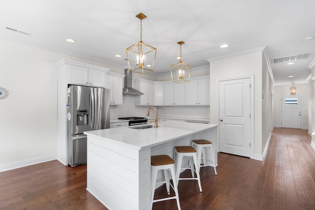 3620 Weathervane, Apison, TN 37302 - kitchen featuring stainless steel refrigerator with ice dispenser, wall chimney exhaust hood, crown molding, a chandelier, and white cabinets