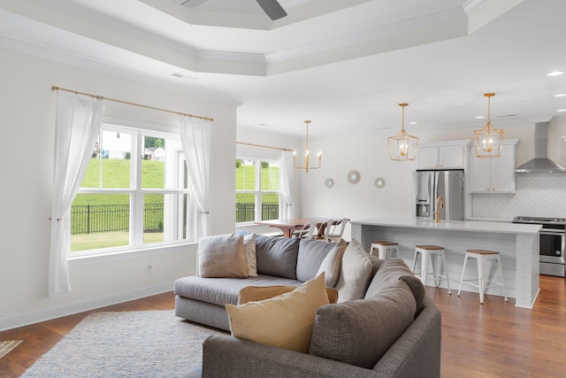 3620 Weathervane, Apison, TN 37302 - living room featuring crown molding, dark wood-style floors, recessed lighting, a tray ceiling, and a chandelier