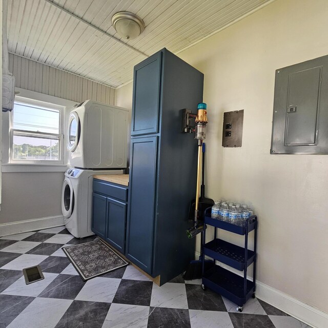 503 S Lovell Ave, Chattanooga, TN 37412 - laundry room featuring stacked washer / drying machine, electric panel, and cabinet space