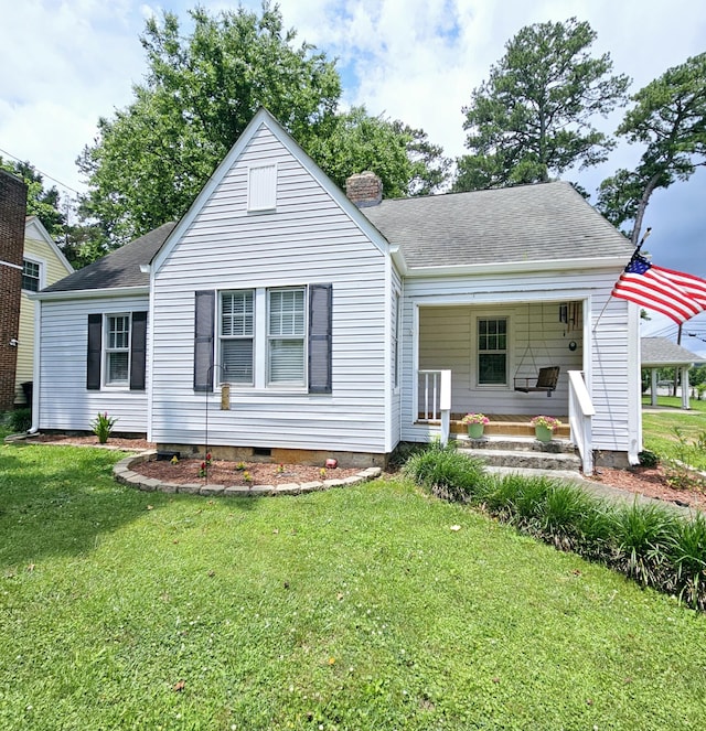 503 S Lovell Ave, Chattanooga, TN 37412 - rear view of house featuring a lawn, a chimney, a shingled roof, and crawl space